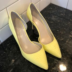 Yellow pumps with open arch